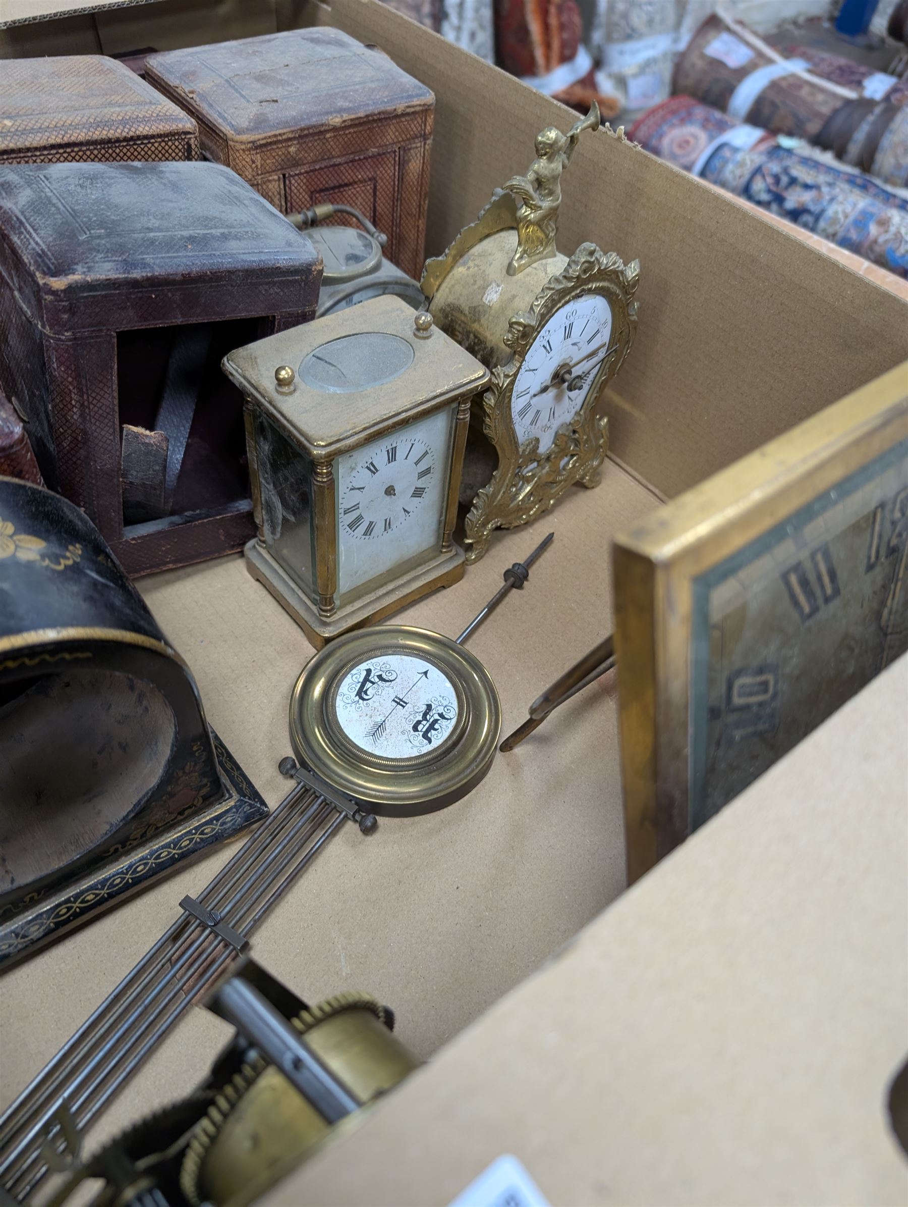 Collection of leather carriage clock cases, brass mantle clocks and parts, brass candlesticks etc, in two boxes