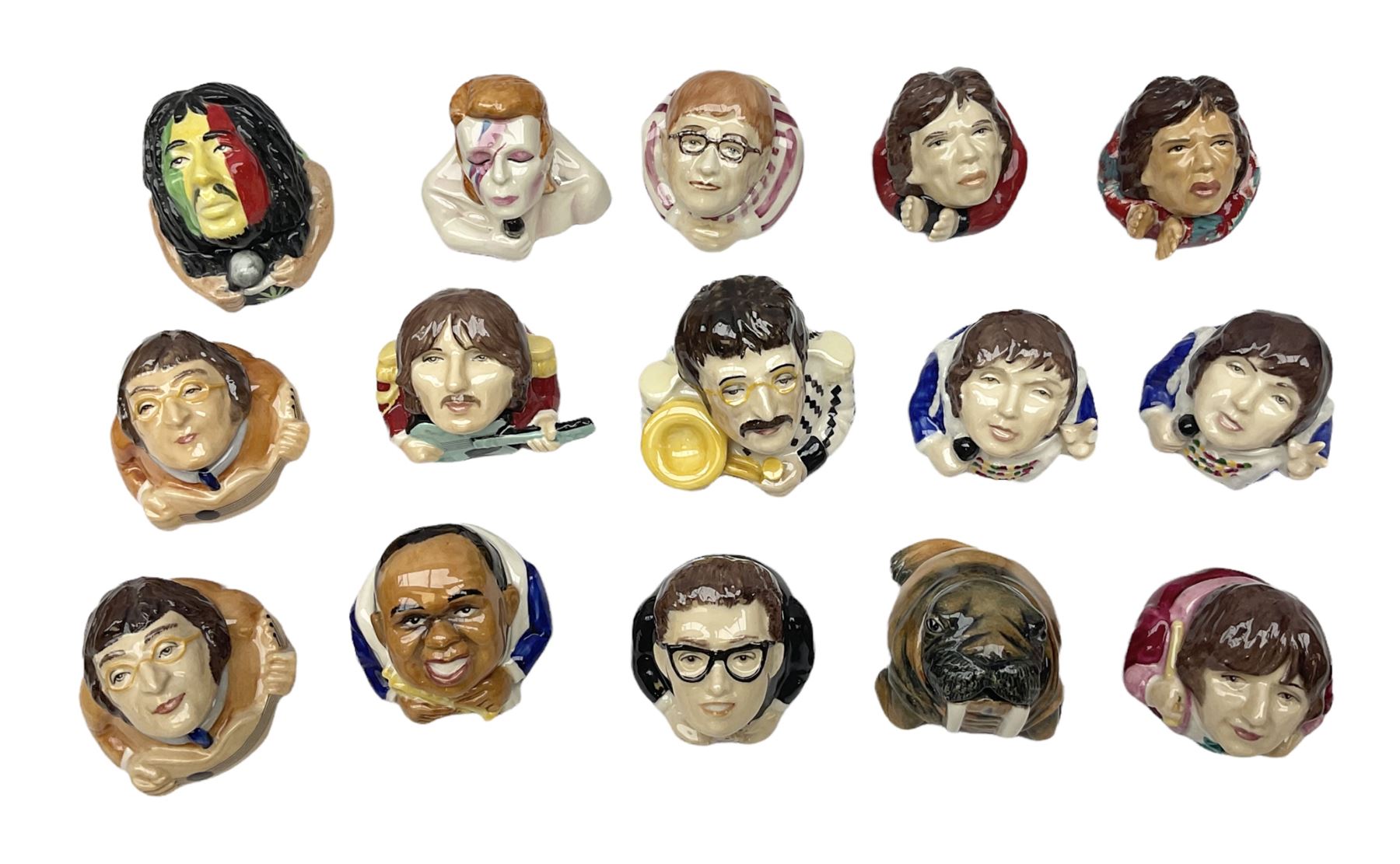 Fifteen Face Pots by Kevin Frances, all of music interest, to include the Beatles; Paul 'Kookoocachu', 'Love Is All You Need', 'Octopus's garden', 'While My Guitar Gently Weeps', 'All You Need Is Love' and 'Everybody's talking and no one says a word', Elton John; I'm still standing, Buddy Holly; 'That will be the day', David Bowie 'We can be heroes' , Mick Jagger prototype colour type etc, all boxed  