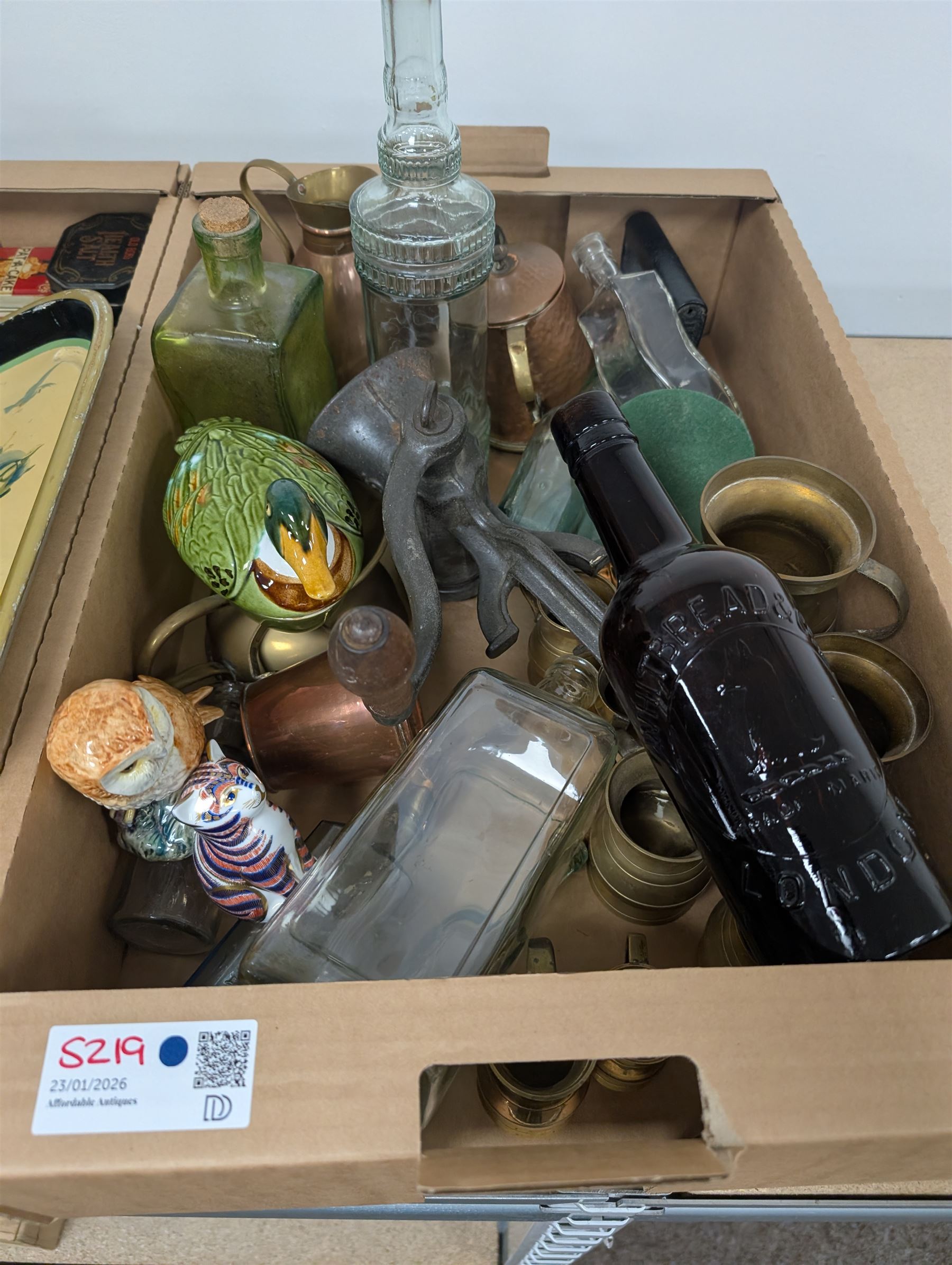 Collection of advertising tins, including Bisto and Cadburys, together with a Guinness 'For Strength' metal tray, brass measures, glass bottles, Royal Crown Derby cat paperweight, etc