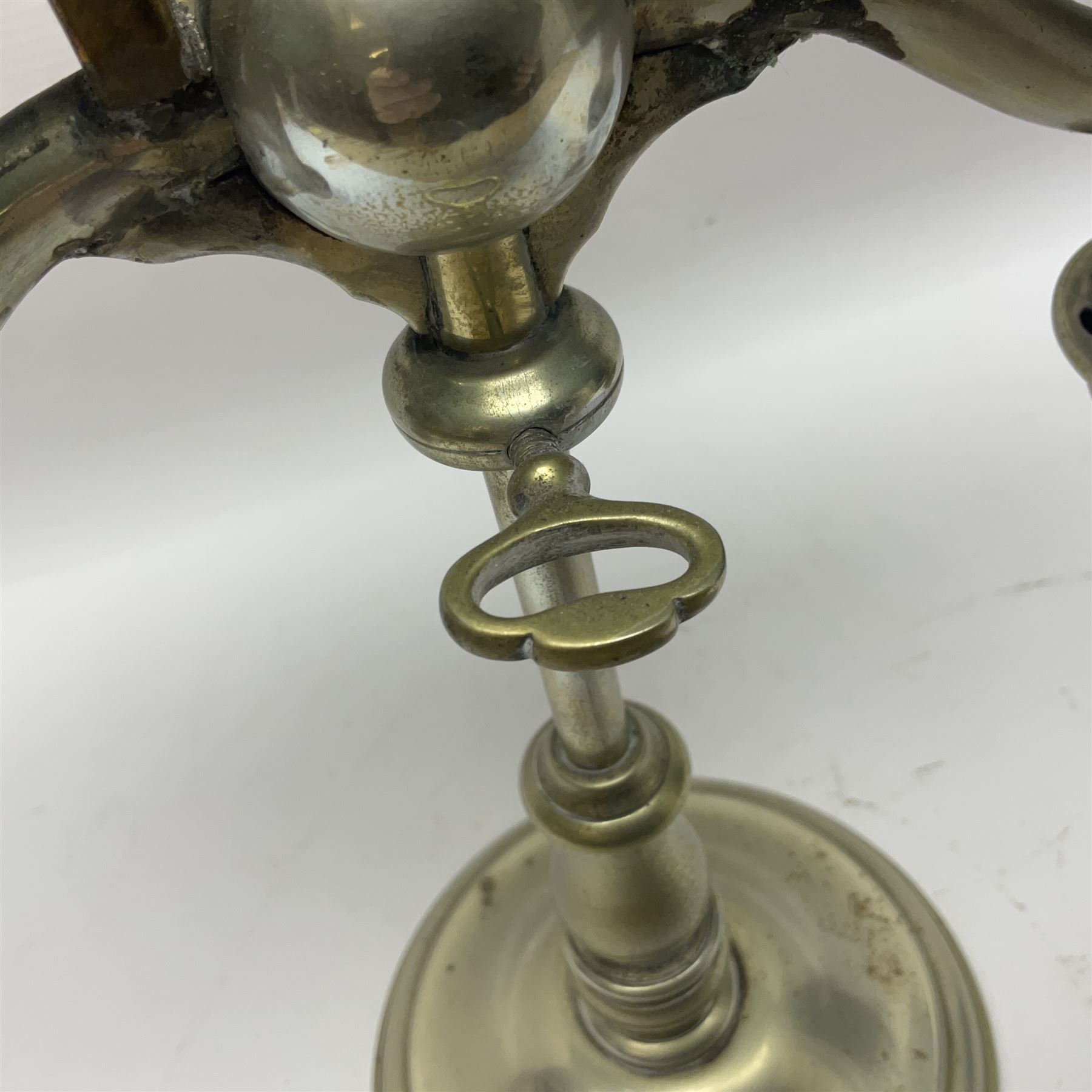 Miller & Sons Piccadilly polished brass double adjustable student's oil lamp, with green glass shades, H52cm