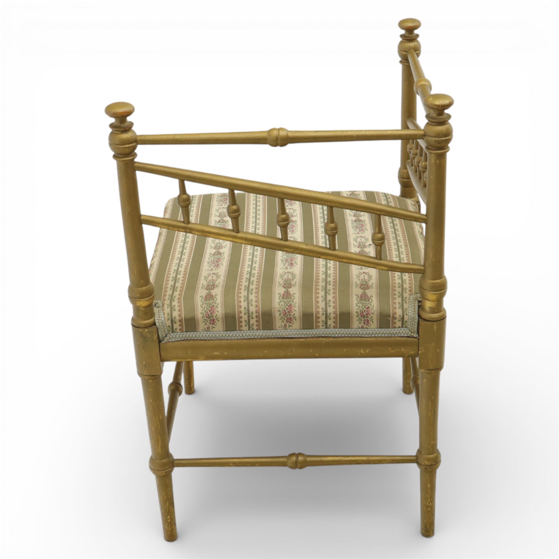 19th century Scandinavian corner chair, with rail back and sides formed with turned spindles and finial terminals, fitted with an upholstered seat in striped floral fabric, raised on turned supports united by stretchers