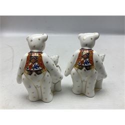 Four Royal Crown Derby teddy paperweights, comprising Teddy Cook, two Teddy George and Seated Teddy, all without stoppers, together with Crown Namestake with gold stopper 