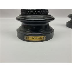 Pair of spelter figures, Le Force and Le Pouvoir, modeled as figures standing on lions, arms held aloft, H51cm 