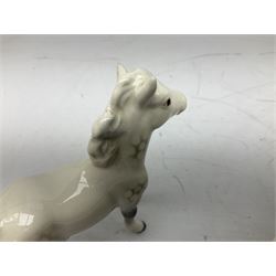 Seven Beswick figures of horses, including Connemara pony in grey no.1641, Arab in bay no.1265, large foal in grey no.947 etc, together with a Goebel figure of a horse (8)