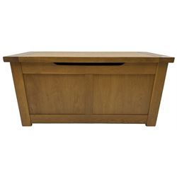 Oak blanket box, hinged lid over panelled front and sides 