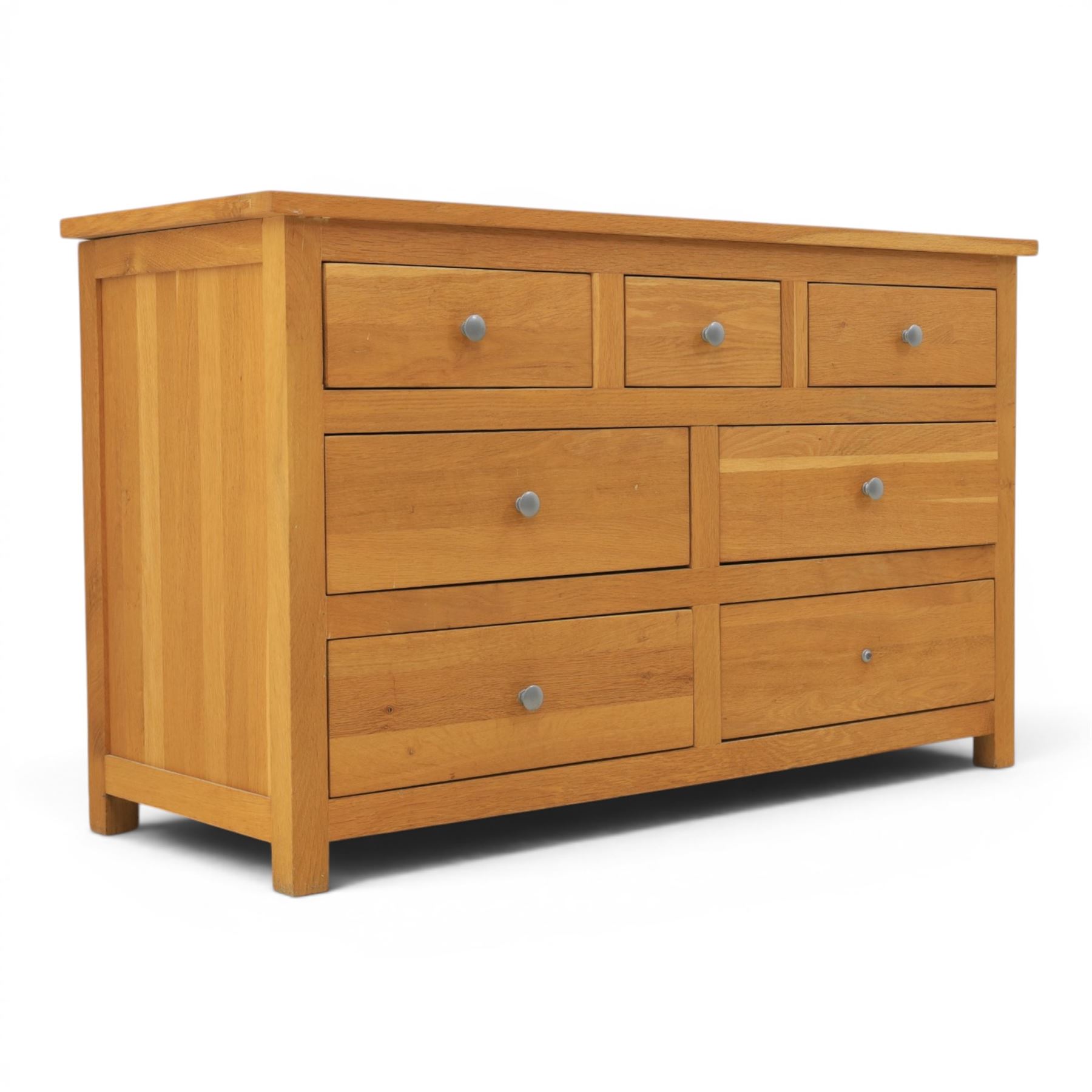 Solid oak chest of drawers, three over four drawers with metal pulls 
