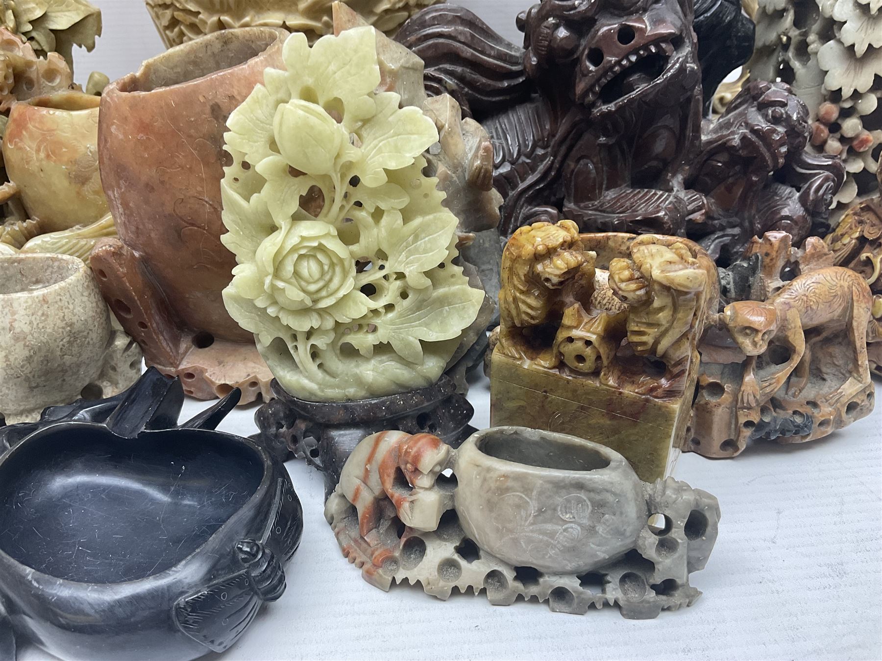 Collection of hardstone and soapstone, including hardstone seal carved temple dogs finial, inscription on base, together with inkwells, vases etc  