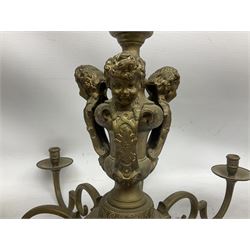 20th century heavy brass eight branch electrolier, detailed with putti masks, approximately H60cm W71cm