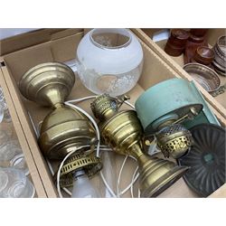 Assorted glassware, to include 19th century decanters, drinking glasses, and a collection of metal ware, including pestle and mortar, two silver plated bottle coasters, oil lamps, etc., in three boxes 