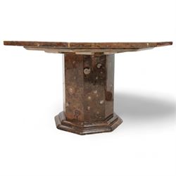 Octagonal specimen table with brass inlay, the limestone tabletop with a central ammonite and orthoceras and goniatite inclusions, upon a stepped octagonal base 