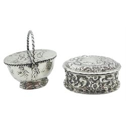 Continental miniature silver box, probably Dutch, modelled as an oval basket with rope twist swing handle and twin hinged covers, decorated in low relief with figures, together with an Edwardian silver box, of oval form with embossed scrolling foliate decoration throughout, hallmarked Cornelius Desormeaux Saunders & James Francis Hollings, Birmingham 1901, approximate total silver weight (58 grams)