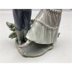Lladro figure, One, Two, Three, modelled as a boy and girl with her foot raised, sculpted by Jose Roig, with original box, No 5426, date issued 1987 date retired 1995, H27cm
