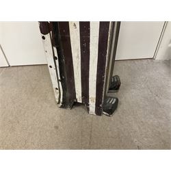 Folk art circus clown cabinet, the the two hinged doors with bow tie decoration opening to reveal fitted shelved interior, the body painted with polka dots and spades, H121cm