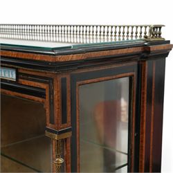 Victorian amboyna and ebonised credenza with glass top, the freeze fitted with two Wedgewood plaques and brass beading above crossbanded arched glazed mirror door flanked by two glazed cabinet doors with two removable glass shelves between four gilt brass reeded floral columns, supported on bun style feet