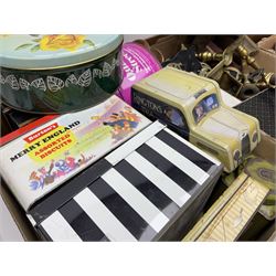 Collection of silver plated cased cutlery including part canteens and butter knives, together with other metal ware including J&J Siddons iron, horse brasses and a copper kettle, 1970s children's annuals including Beano, two handbags and three suitcases, vintage tins etc, in four boxes 