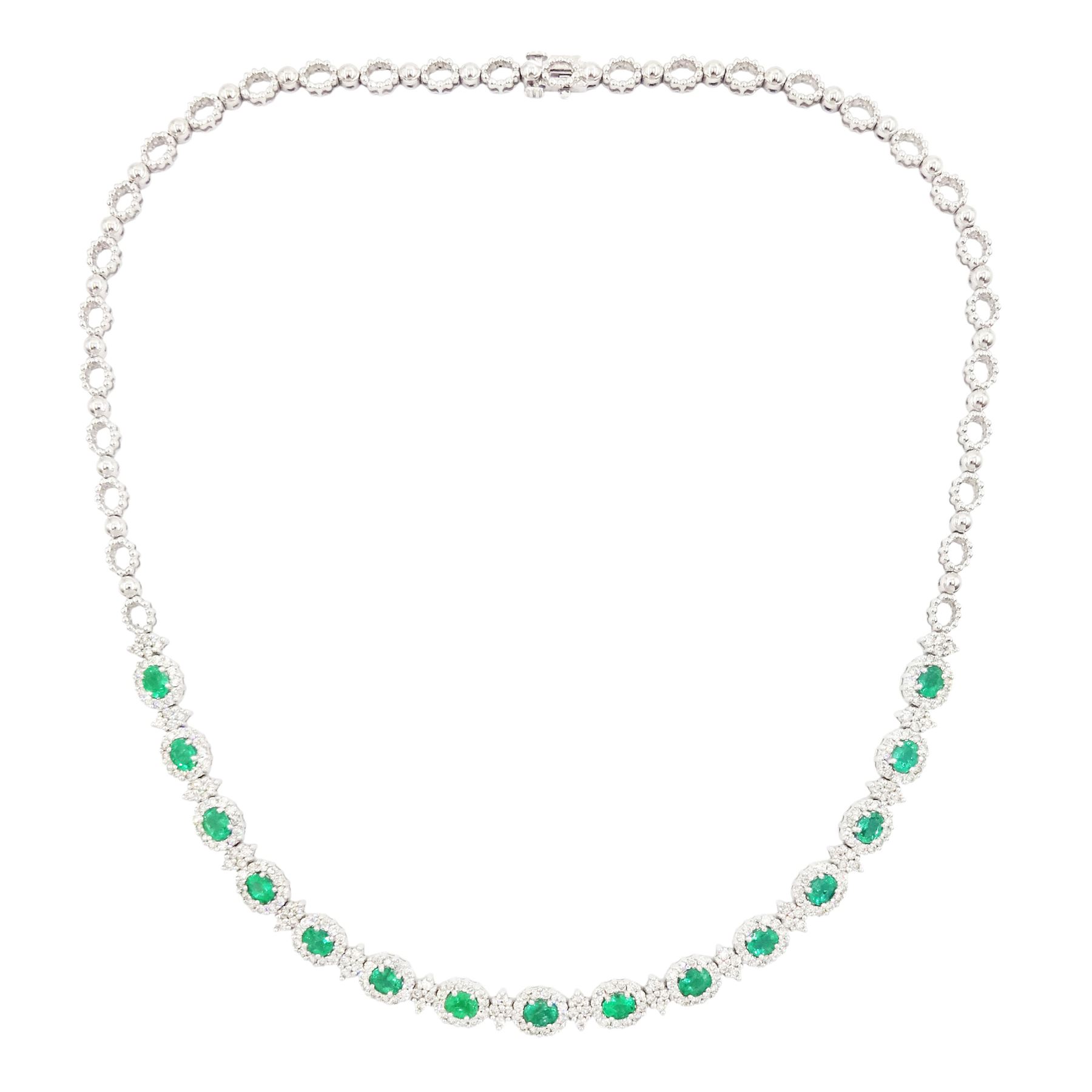 18ct white gold emerald and diamond necklace, fifteen oval cut emeralds, each surrounded by twelve round brilliant cut diamonds and spaced by a further four diamonds, to a fancy openwork oval and bead link necklace, stamped, total emerald weight approx 3.30 carat, total diamond weight approx 2.45 carat