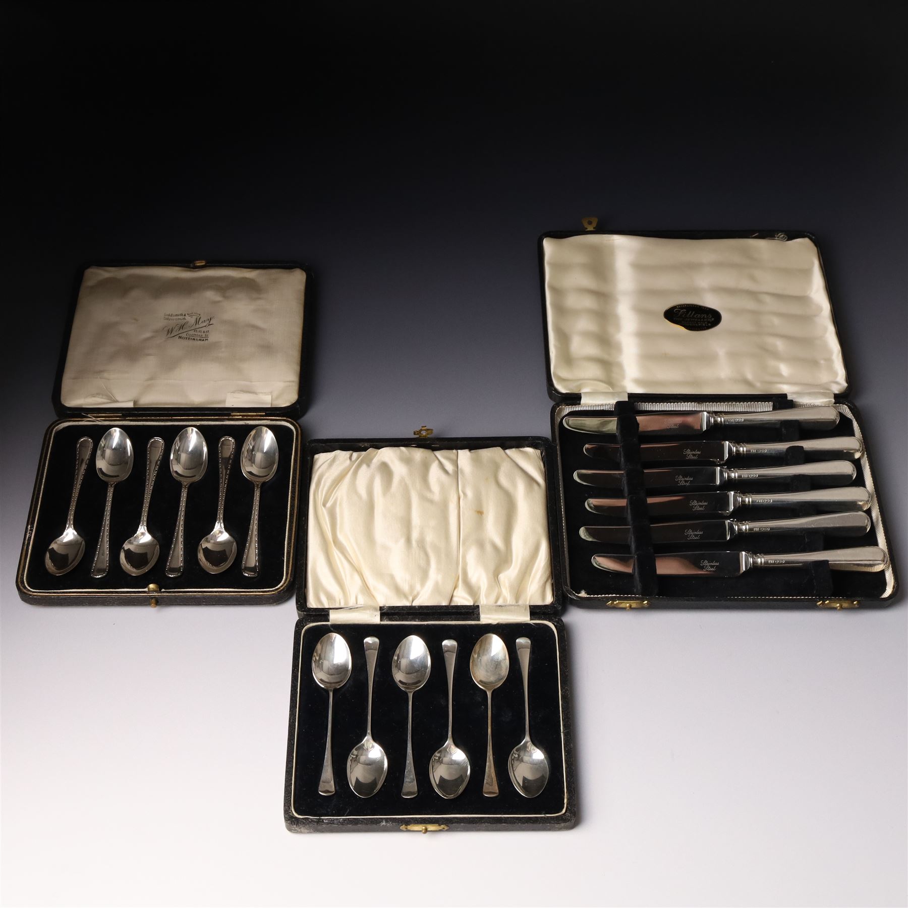 Set of six silver coffee spoons Birmingham 1933 , another set with bright cut stems and set of six silver handled pastry knives, all cased