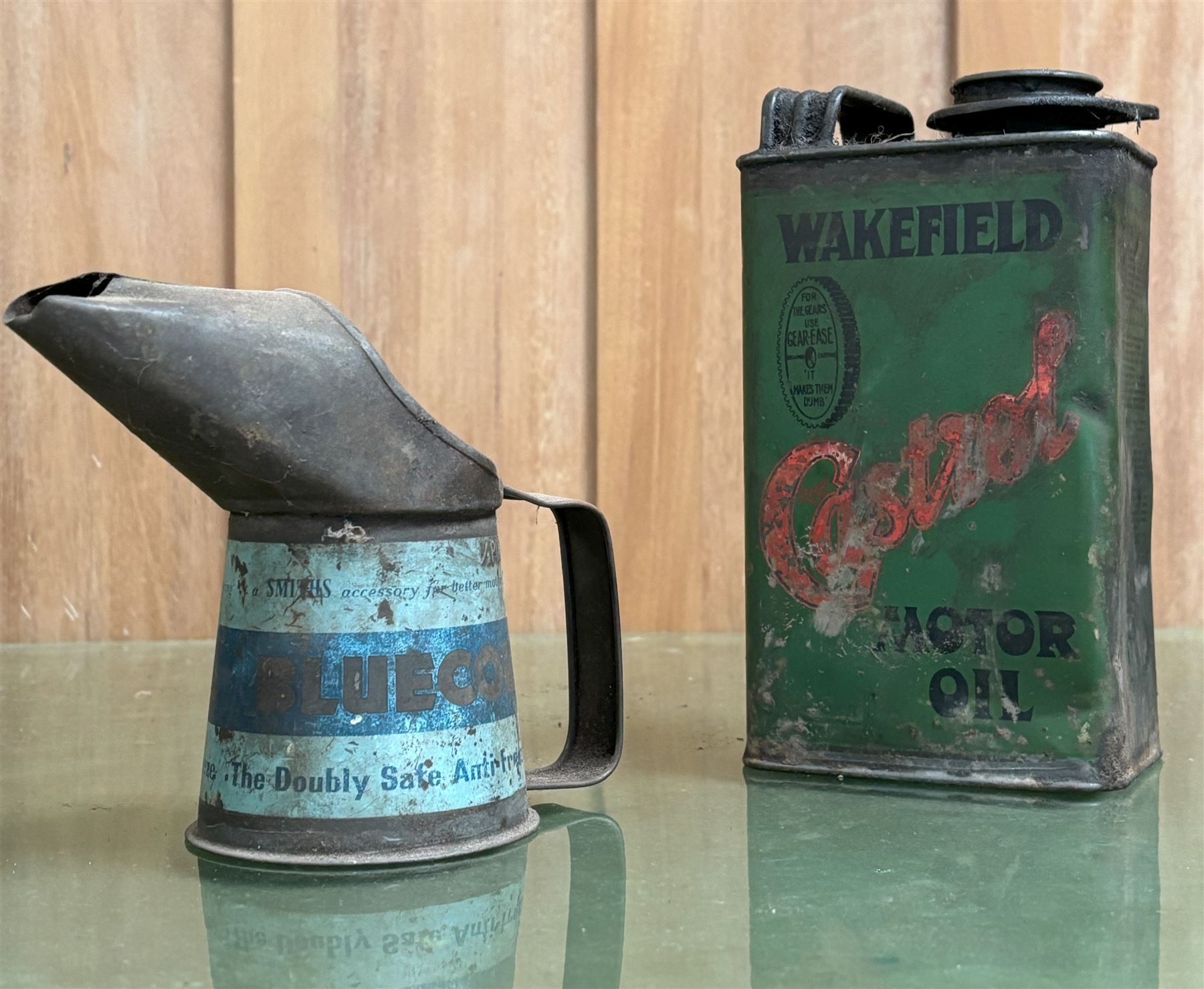 Early Wakefield Castrol motor oil tin (H20cm) together with a Bluecol 1/2 pint pourer (H13cm) (2)  - COLLECTION BY APPOINTMENT FROM: The White House, Thirsk Road, Easingwold, York, YO61 3NF - CALL 01723 507111 TO ARRANGE