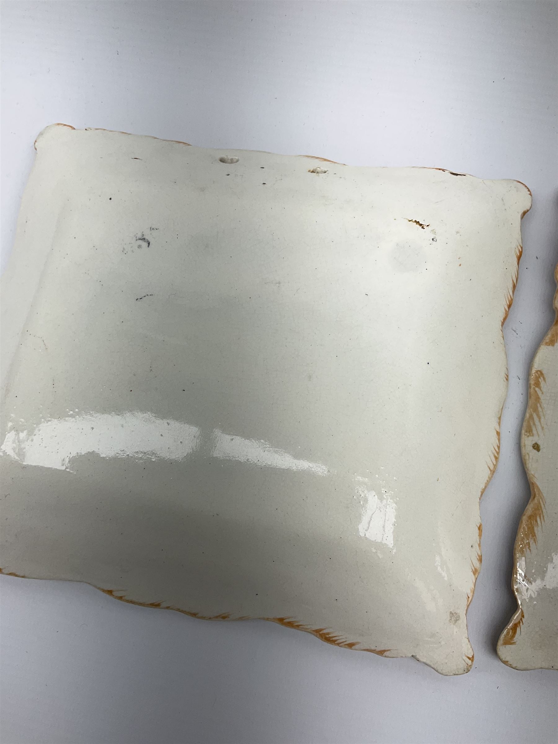 Two 19th century Sunderland orange lustre wall plaques, the first example inscribed Thou God Seest Me, the second example inscribed Prepare To Meet Thy God, H20cm L23cm.