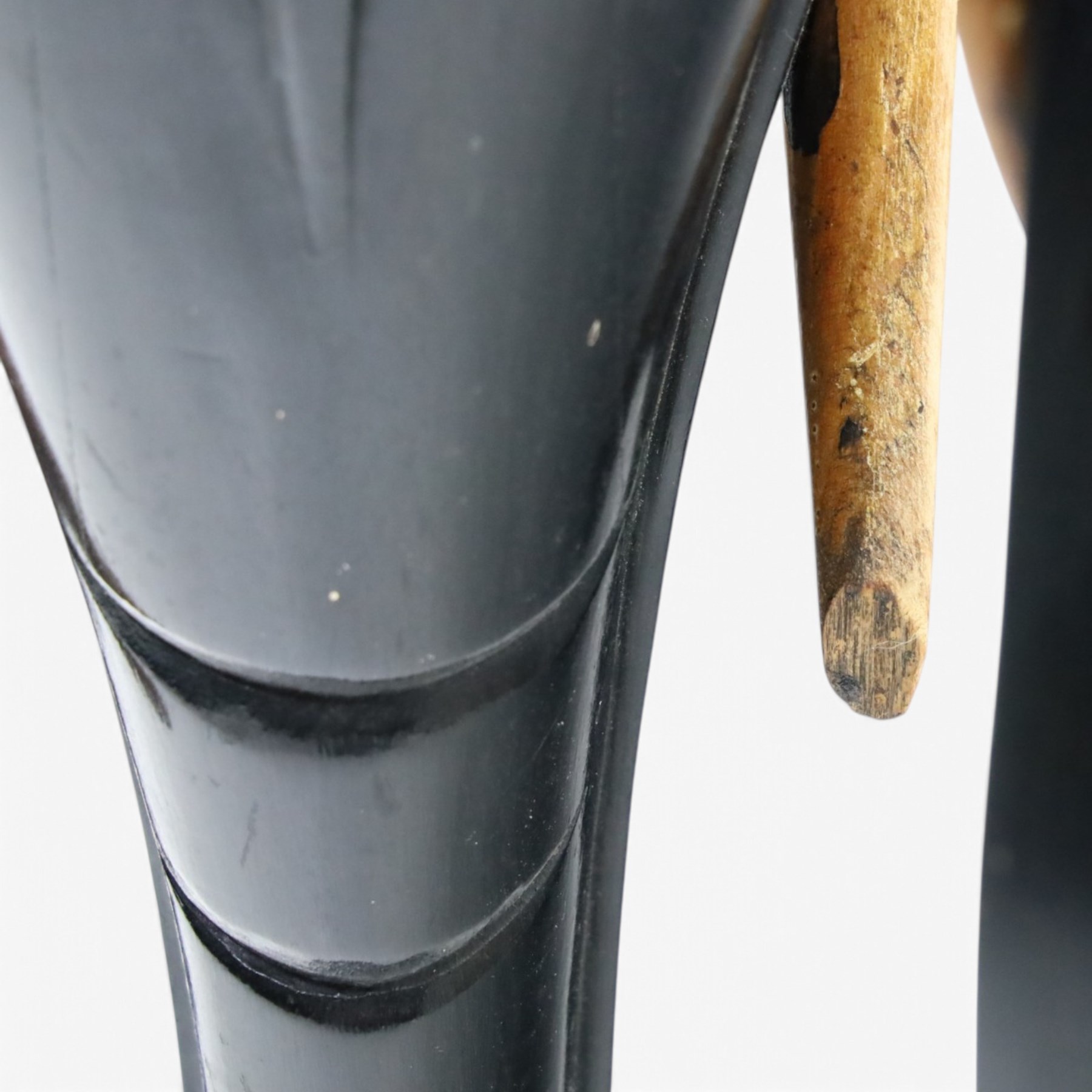 Elephant ebonised jardinière, moulded circular top raised on carved Elephant supports united by a shaped undertier