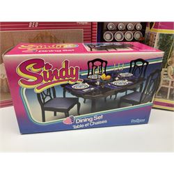 Sindy - furniture and accessories comprising dining suite with separate dresser; two beds; Garden Set; Music Centre; all  boxed; three-piece bedroom suite; settee; Hostess Trolley; two coffee tables; and four-piece bathroom suite including shower cubicle