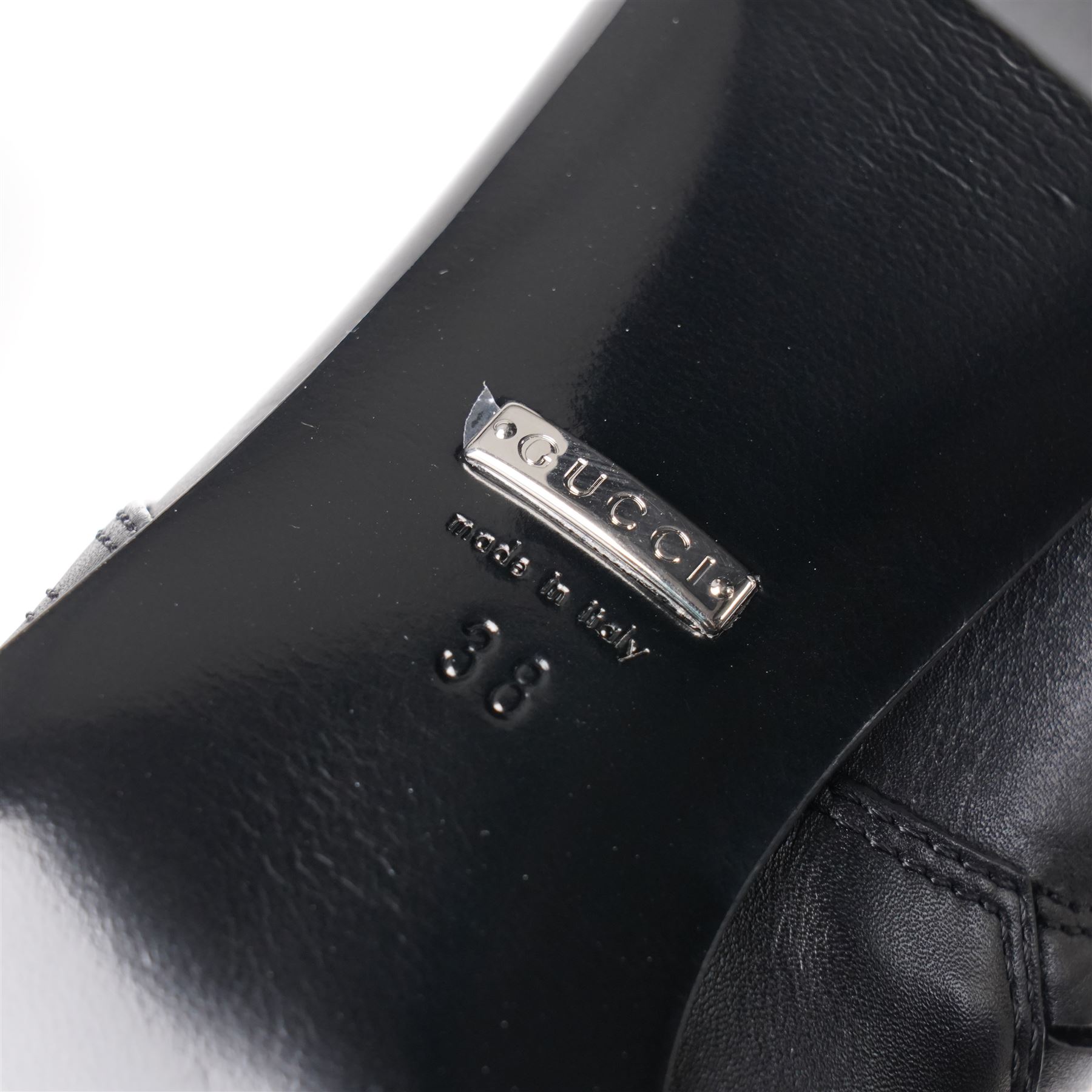 Gucci - pair of Dionysus buckled knee-high leather boots, in black with block heels, applied with rhinestone star, moon and heart applique motifs, with the signature silver tone tiger head buckle fastening and full length zip, size 38, total boot height 48cm, unused with original box and dust bags