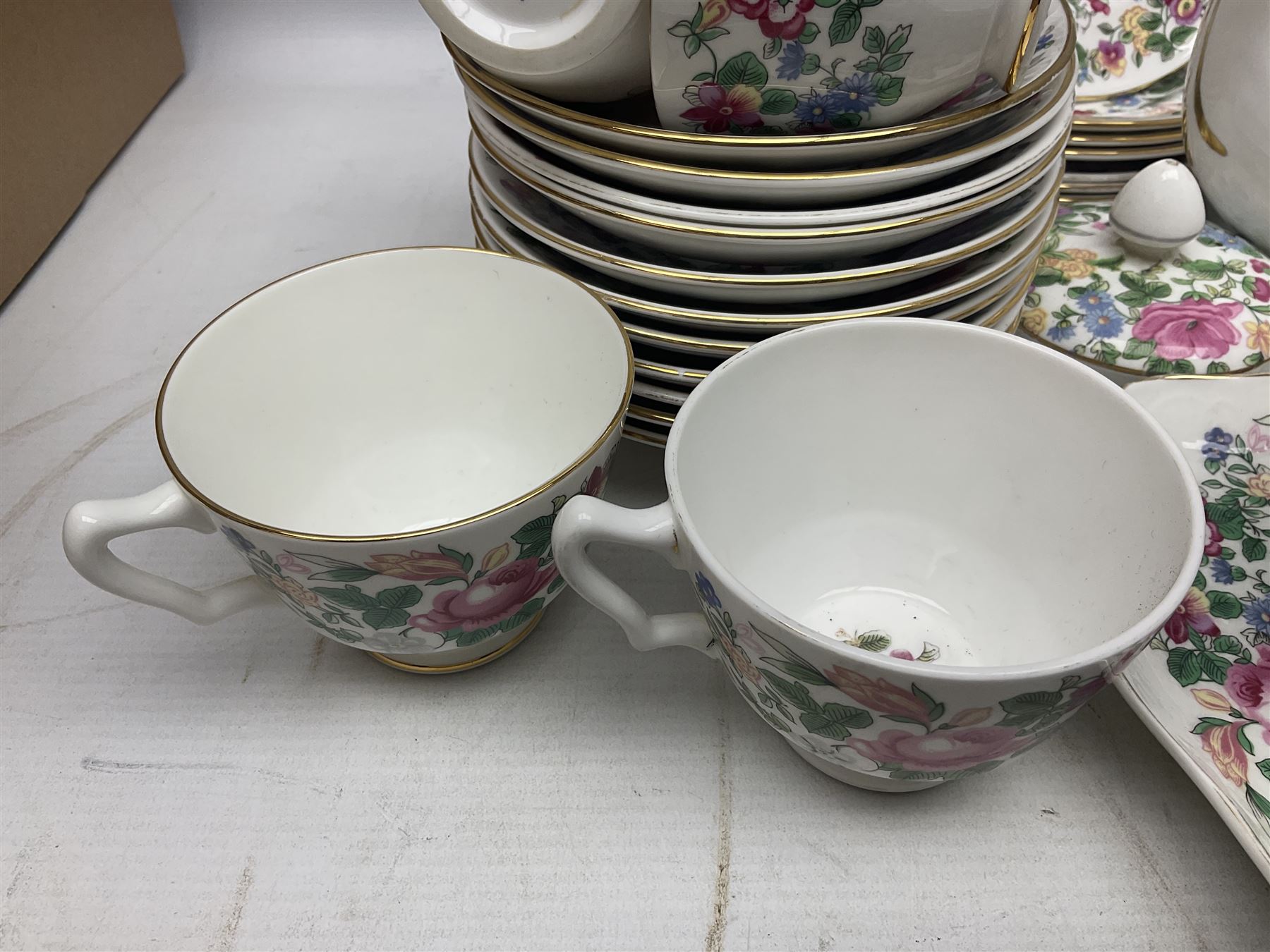 Crown Staffordshire Thousand Flowers pattern part tea service, to include teapot, two open sucriers, eighteen cups, fifteen saucers etc (57)