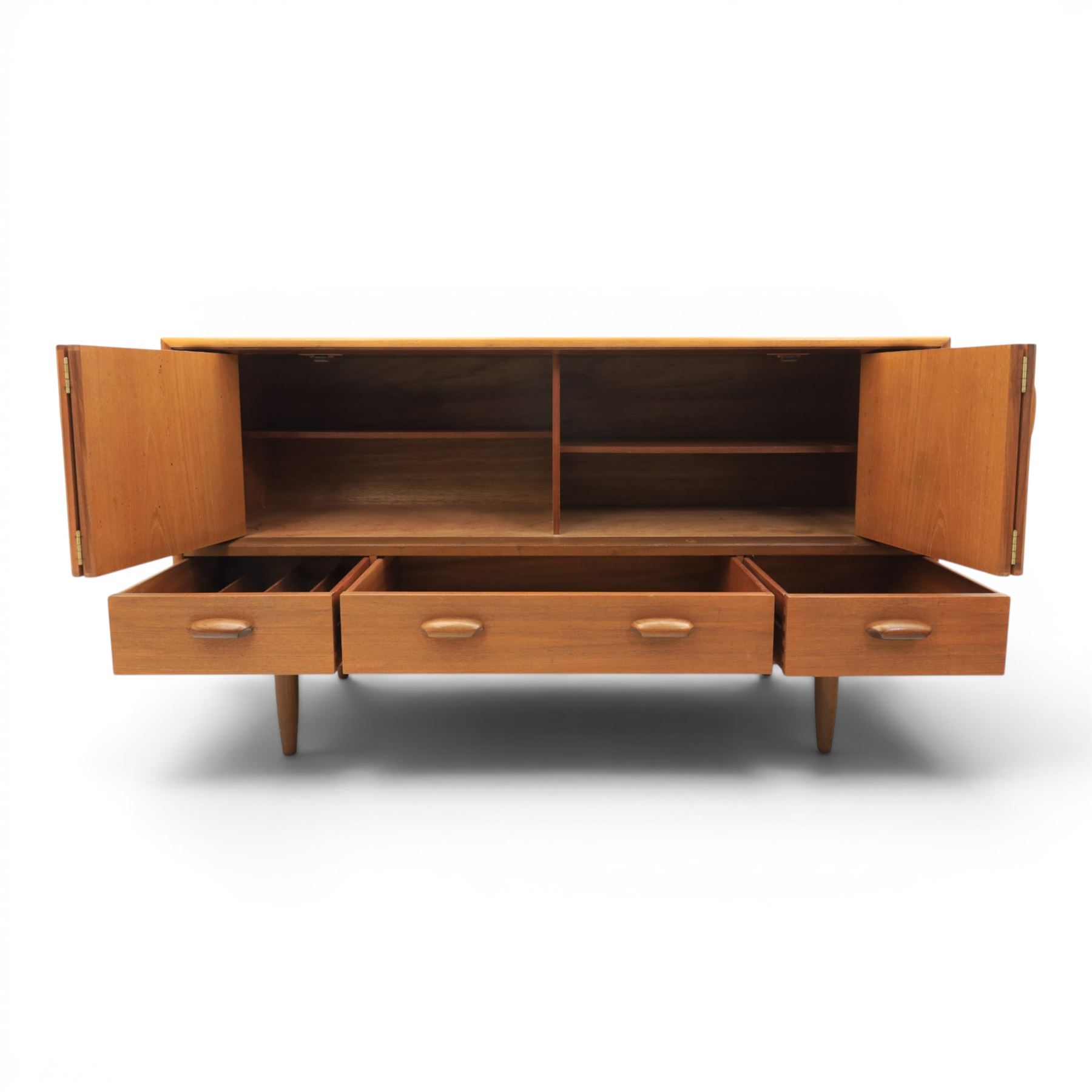 G-Plan - 'Brasilia' teak sideboard, with rectangular top above two concertina doors, above four drawers raised on cylindrical supports