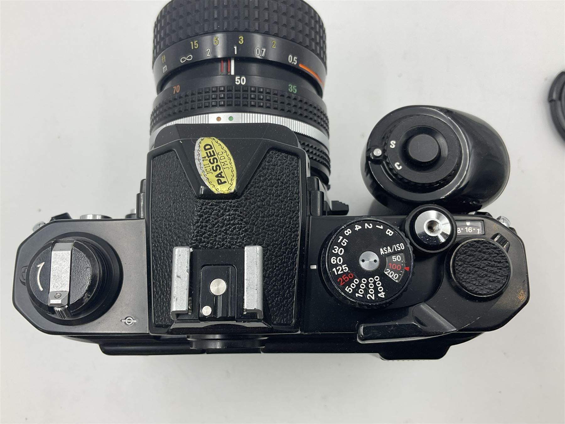 Nikon FM2n camera body, serial no. N8683100, with 'Nikon Zoom-NIKKOR 35-70mm 1:3.3-4.5' len, serial no. 2236565, Nikon MF-16 data back, serial no. 212905 and Nikon MD-12 Motor Drive, serial no 1570382 