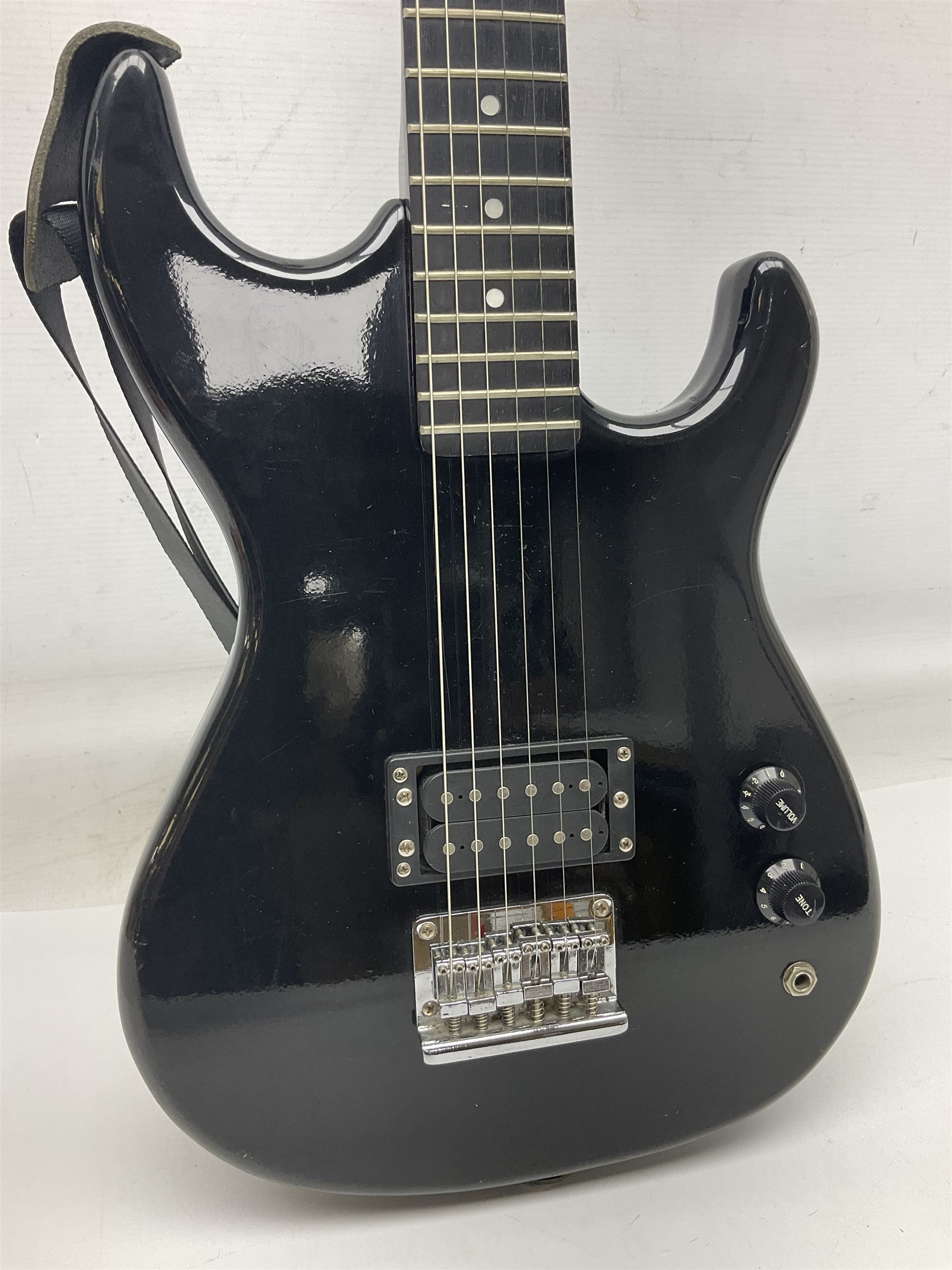 Encore black electric cut-away guitar L96cm; and Spanish Victor Garcia model 187 acoustic guitar, bears label dated 1972 L99cm; each in soft carrying case (2)