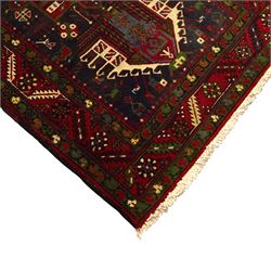 Large Northwestern Persian Hamadan hand-knotted runner, indigo field, with a column of bold geometric medallions and scattered stylized motifs within a madder border of angular rosettes and meandering vines 