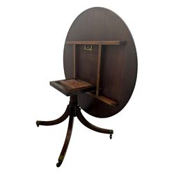 Early 20th century Regency design mahogany tilt-top table, circular top with edge banding, supported by a central turned pedestal with four reeded sabre supports terminating in castors; six chairs with pink upholstered drop in seats (7)