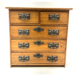An Edwardian walnut apprentice chest of drawers, with two short drawers over three long drawers, and drop handles, H30cm D13.5cm L31cm. 