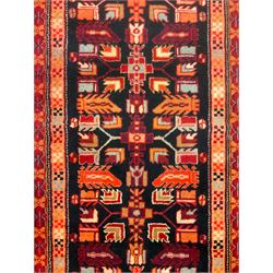 North West Persian Heriz runner, dark indigo ground field decorated with Herati motifs, peach and red borders with geometric design 