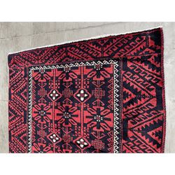 Turkman red and blue ground rug, overall geometric design, decorated with stylised motifs