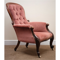  Victorian mahogany framed salon armchair, upholstered in a deep buttoned salmon fabric, cabriole legs on castors, W65cm  