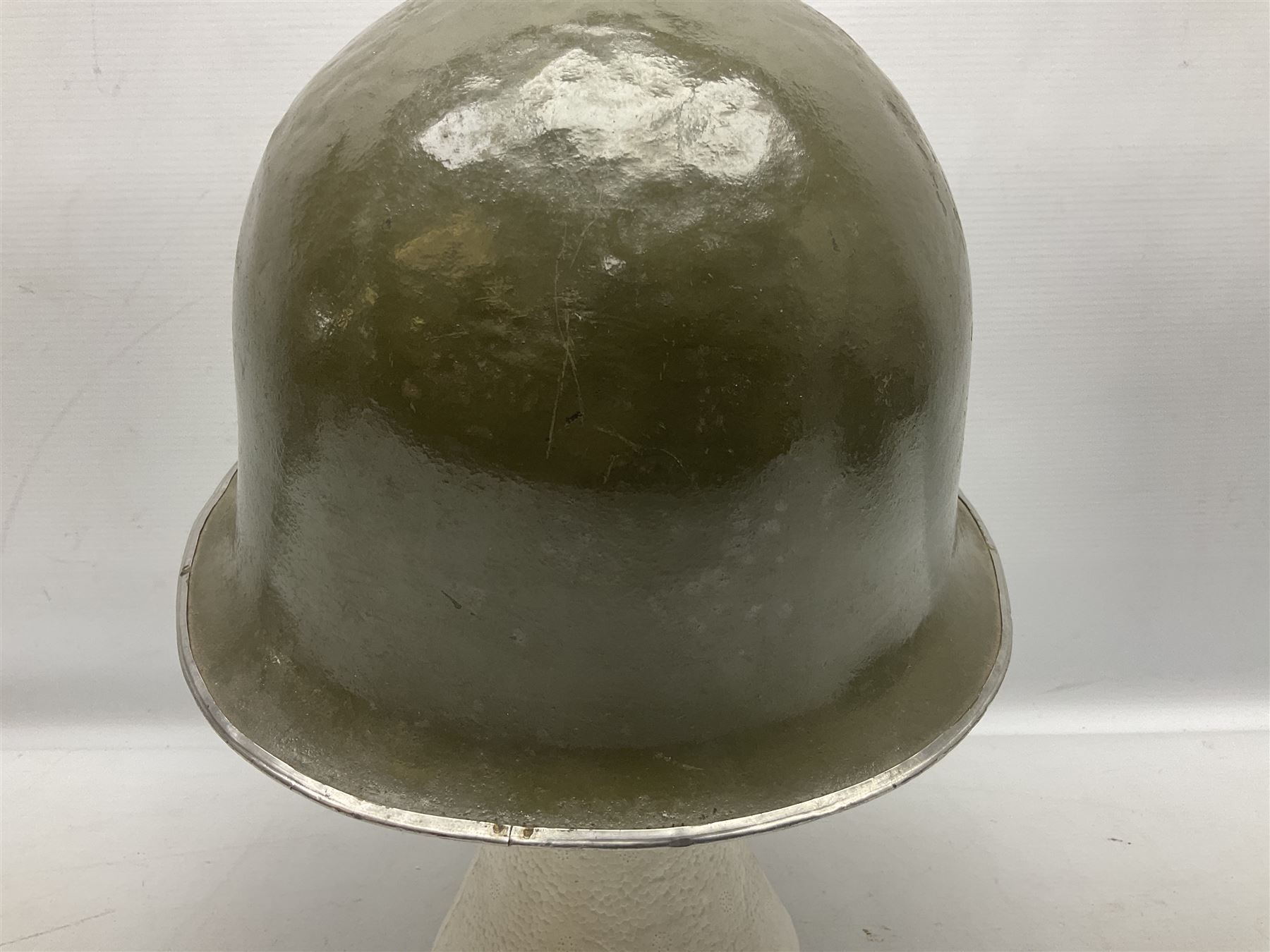 1950s French Algerian War steel helmet with liner; indistinctly marked 'S.I.A. LE EANS(?) 71R'