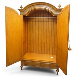 And So To Bed - French design ‘Eclectic’ double wardrobe in light finish, arched moulded cornice with carved foliate band and turned finials, two mirrored doors enclosing a hanging rail, flanked by turned columns with foliate decoration, single fluted drawer below, on turned tapering feet