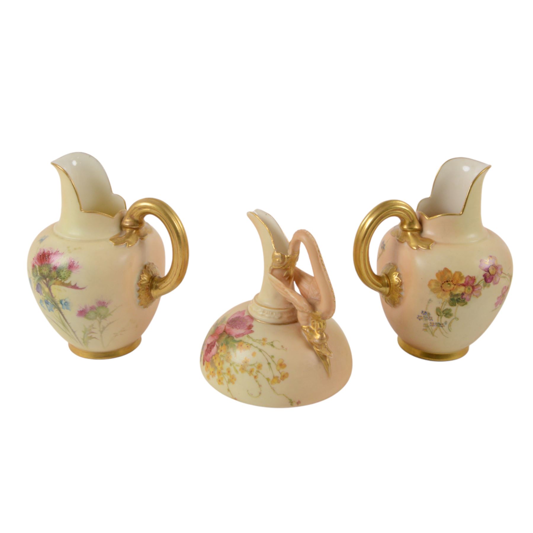 Royal Worcester Blush Ivory, comprising reticulated pot pourri jar upon eagle support, with black printed mark beneath, twin handled posy vase, shape no. 1556 with pink fluted body and puce mark beneath and three jugs, including shape no. 1018 example with bird mounted handle and two shape 1094 examples, all decorated with floral sprigs and with puce marks beneath, tallest H21cmn