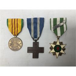 Seven worldwide medals - Austro-Hungarian Kaiser Franz Joseph Jubilee Medal 1848-98; Liberation of Kuwait; Italian War merit Cross 'Vitt Emm III Merito De Guerra'; silver shooting medal 1928-33; two Vietnam medals; and another; all with ribbons (7)