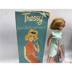 1960s Palitoy Tressy fashion doll, boxed with stand and booklets; four additional Tressy outfits (In The Office, Winter Journey, Winter Sports and Evening Date); two other outfits; and Tressy's Little Sister Toots doll with Style Book and additional outfit