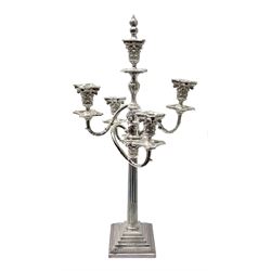 Large silver plated four branch candelabra, the Corinthian column stem supporting four curved acanthus detailed branches with conforming Corinthian sockets, beaded nozzles and drip pans, beneath a central conforming socket with flame finial snuffer, H70cm