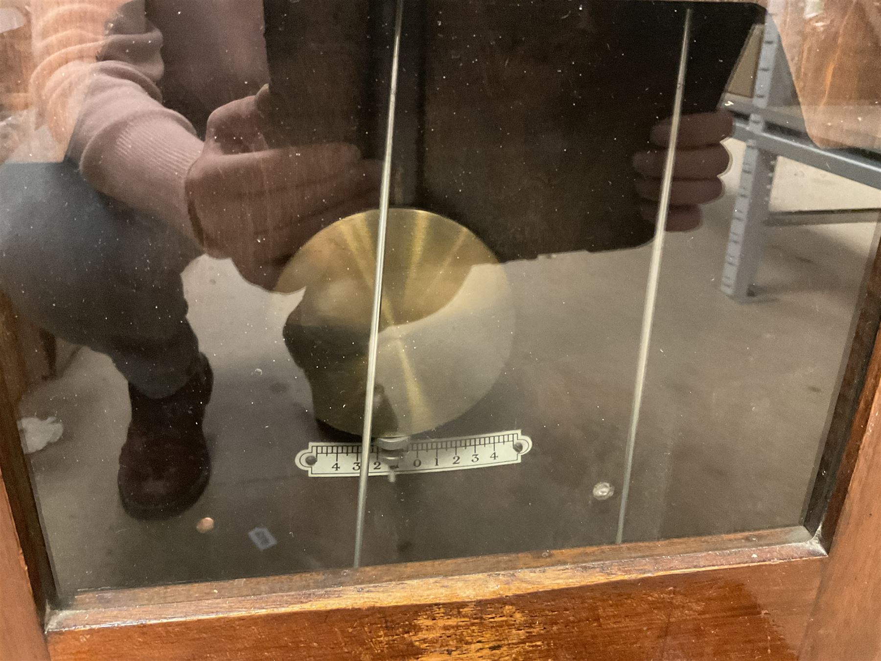 Early 20th Century Time Recorders Leeds Ltd mahogany cased clocking in machine, the square silvered dial with Arabic numerals above clocking in mechanism on plinth base, with a collection of blank clocking in cards, case H98cm