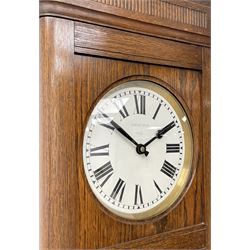 Early 20th century Art Deco oak longcase clock, circular dial with roman numerals and minute track, dial signed 'Barnby & Rust, Hull', twin chain driven movement striking the hours on gong rods. With weights and Pendulum.