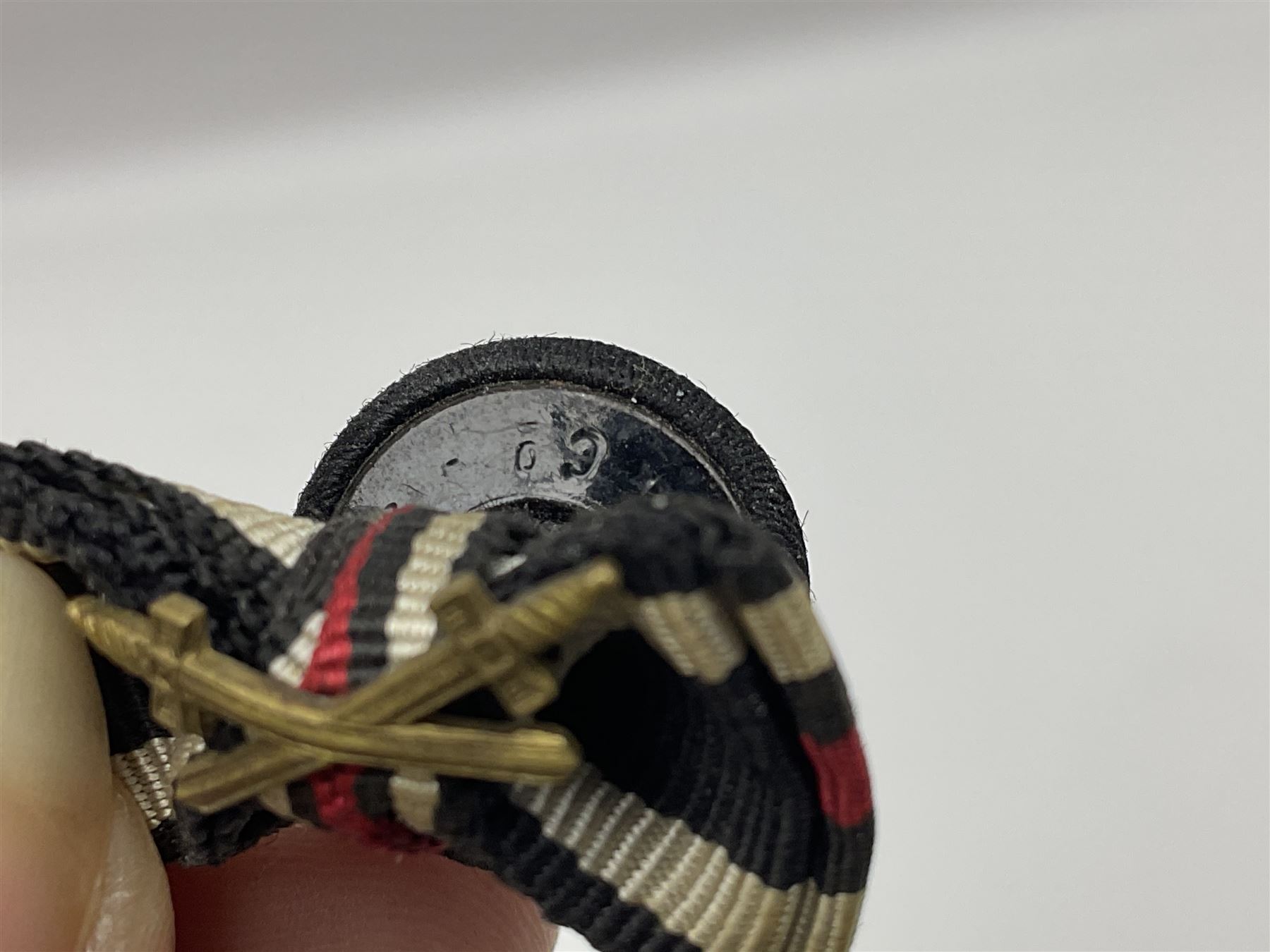 Four German awards - pre-WW2 two-position button hole ribbon for 1914 Iron Cross; WW1 wound badge open back cut-out version with silvered finish; miniature version Mother's Cross with ribbon bow; and The Eastern Medal, officially the Winter Battle in the East 1941–42 Medal (4)