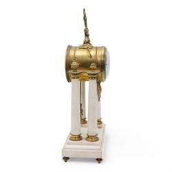 French - White marble and gilt 8-day mantel clock c1900,  with a rectangular plinth raised on four feet, gilt drum movement supported on four tapered pillars with gilt torus base and pineapple finials, convex enamel dial with floral swags and Arabic numerals, minute markers and gilt Louis XV hands, twin train Parisian countwheel striking movement, striking the hours and half-hours on a bell. With a sunburst pendulum.