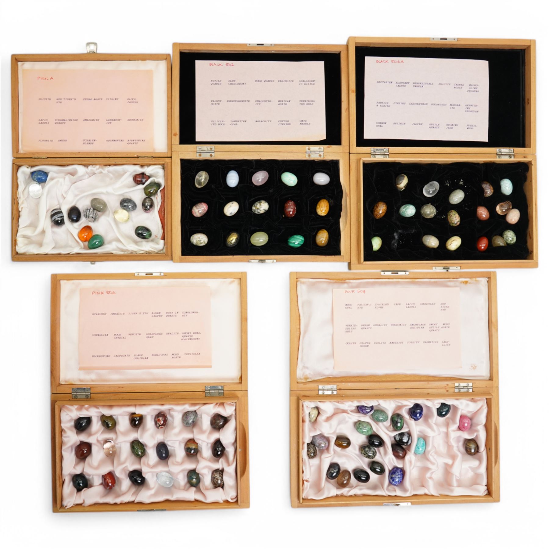 Collection of approx ninety named semi precious stone eggs in five Dunhill cigar boxes 