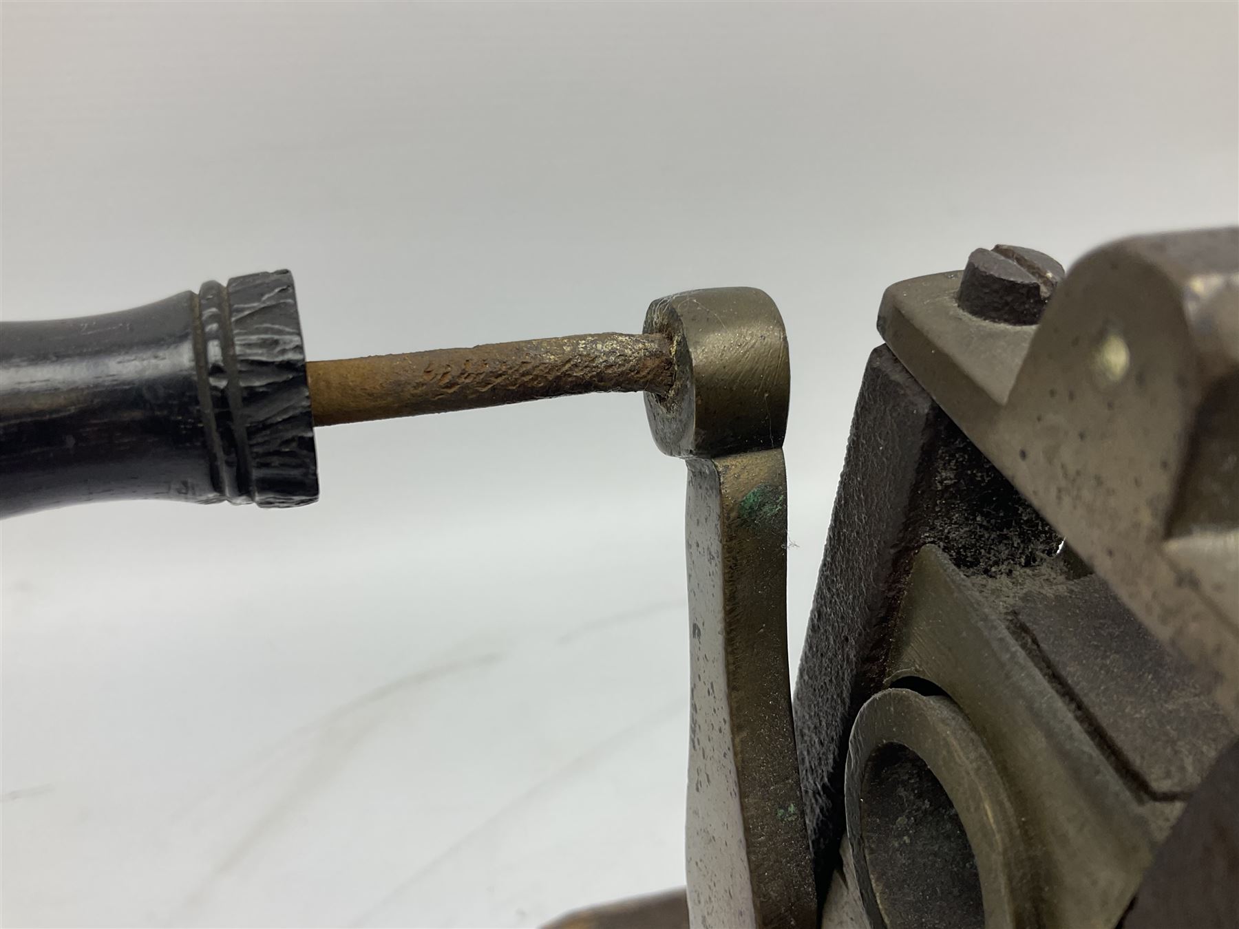 Victorian cuff and collar tabletop mangle, the ribbed brass rollers in a cast iron frame mounted on a wooden base