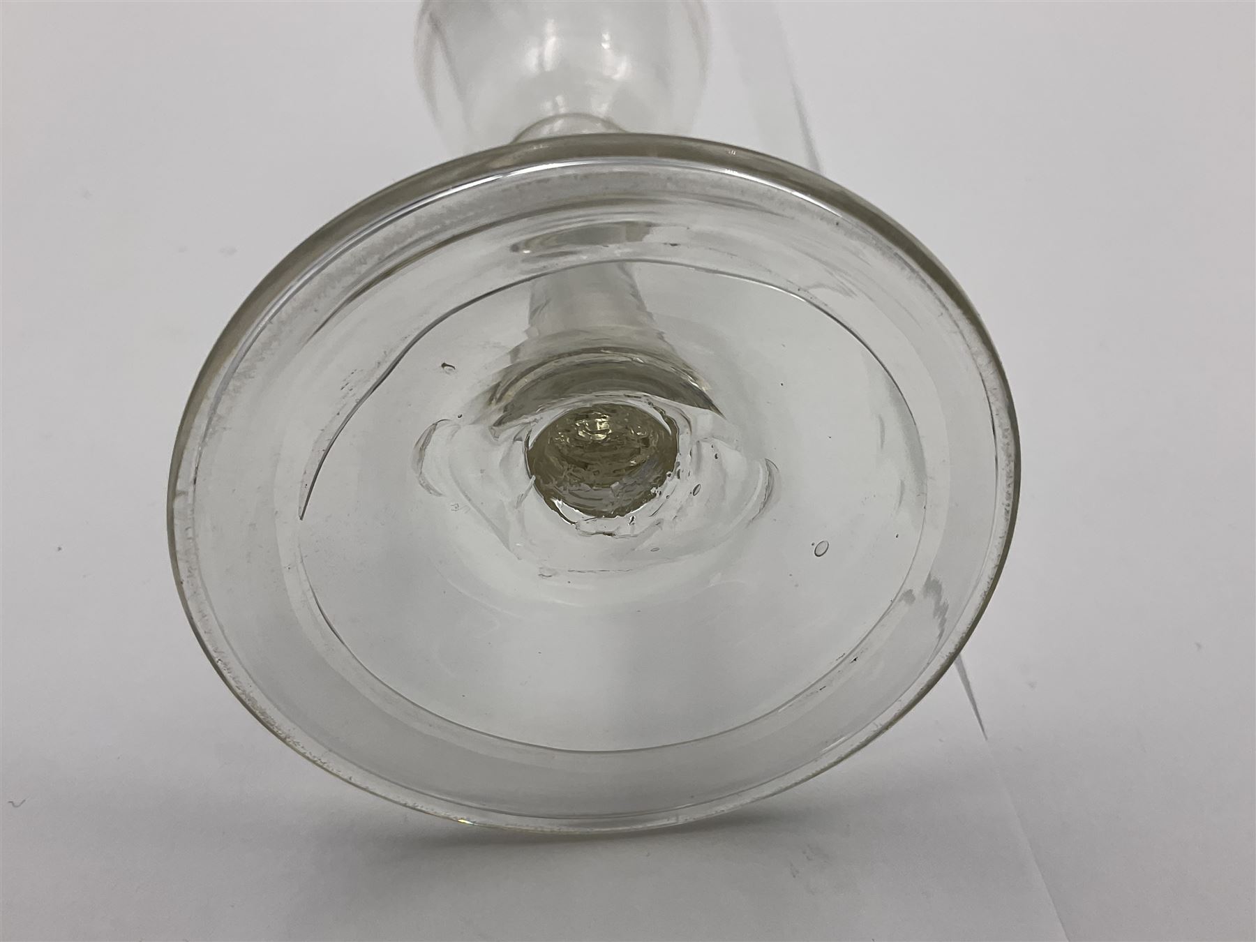18th century wine glass, the trumpet shaped bowl upon tear drop stem and conical folded foot, H15.5cm, together with an 18th century cordial glass, the round funnel bowl on plain knopped stem and folded conical foot