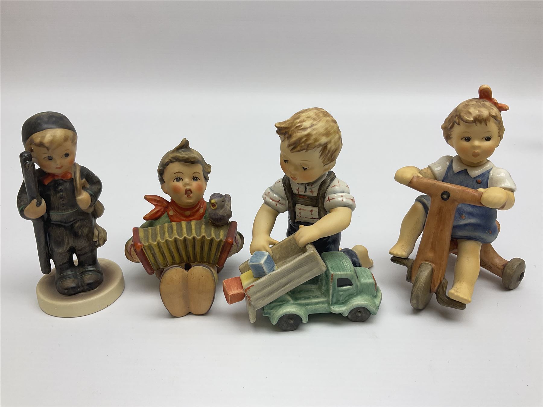 Twenty six Hummel figures by Goebel, to include Fire Fighter, Band Leader and Spring Sowing